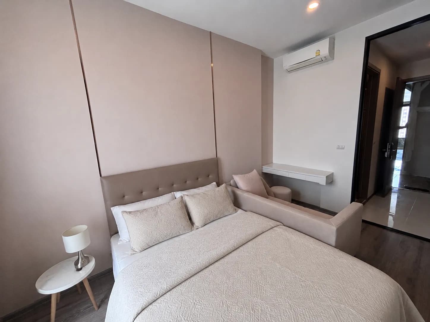 Furnished studio bed and sofa area at KnightsBridge Prime Onnut