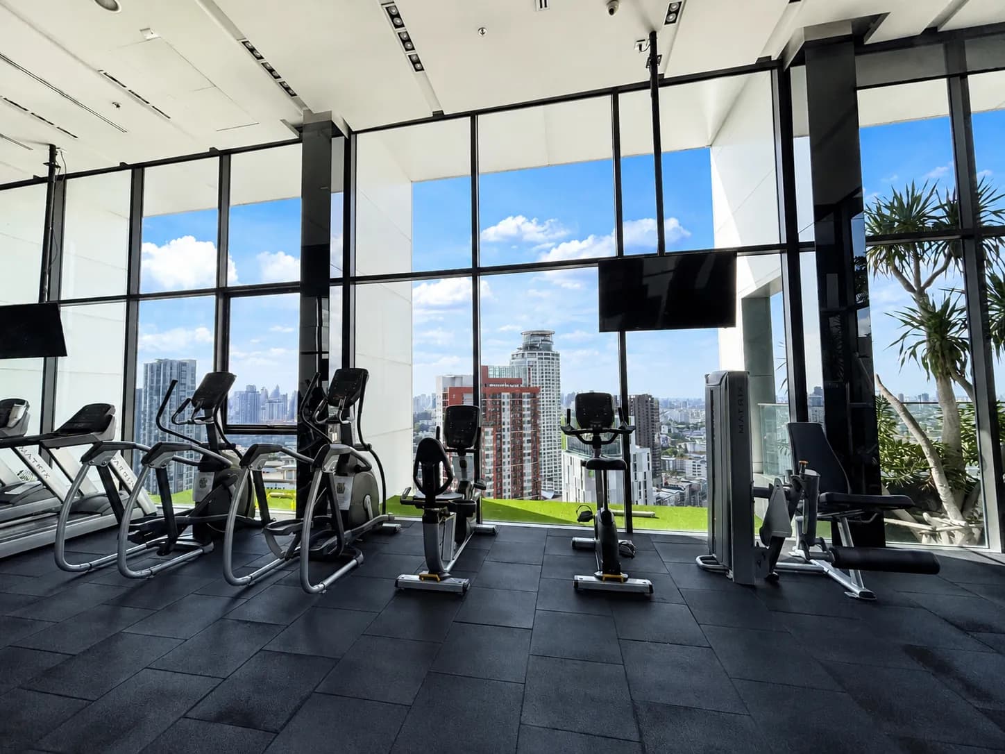Fitness center with city view at Life Sukhumvit 48