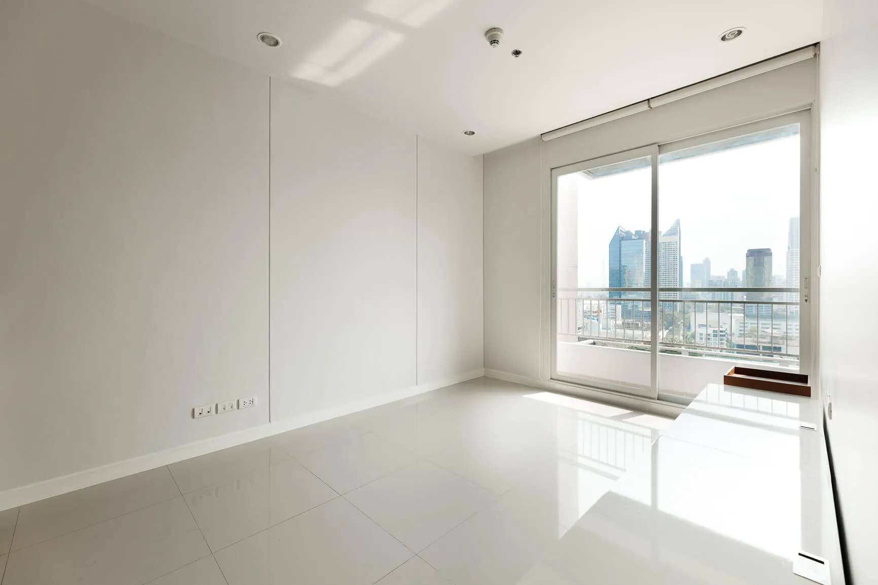 Circle Condominium bedroom with skyline-facing balcony doors
