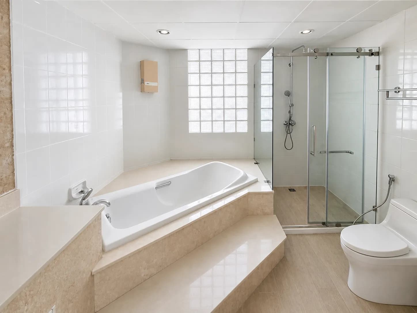 Bathroom with bathtub and shower in The Regency unit