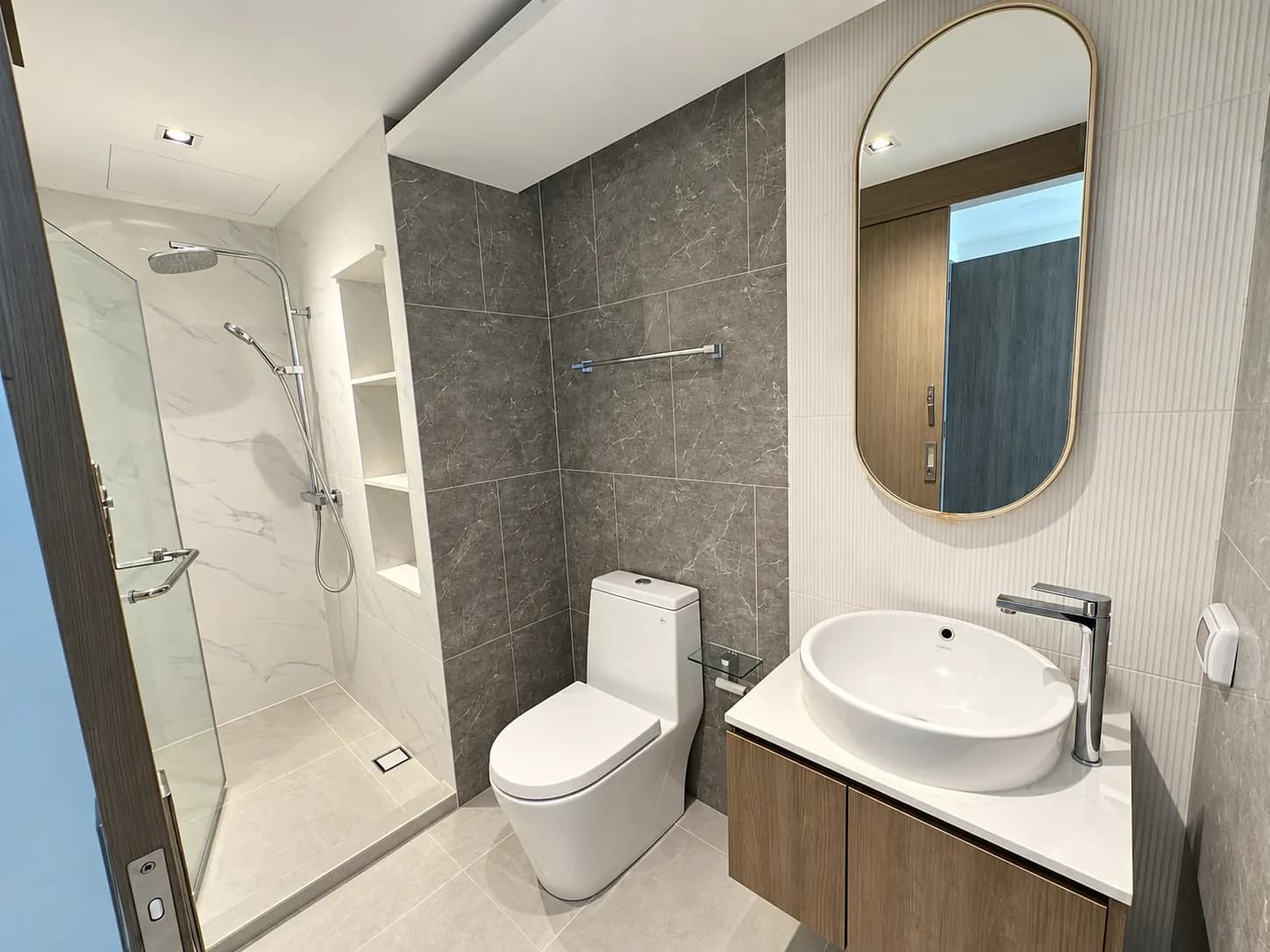 Bathroom with shower and vanity