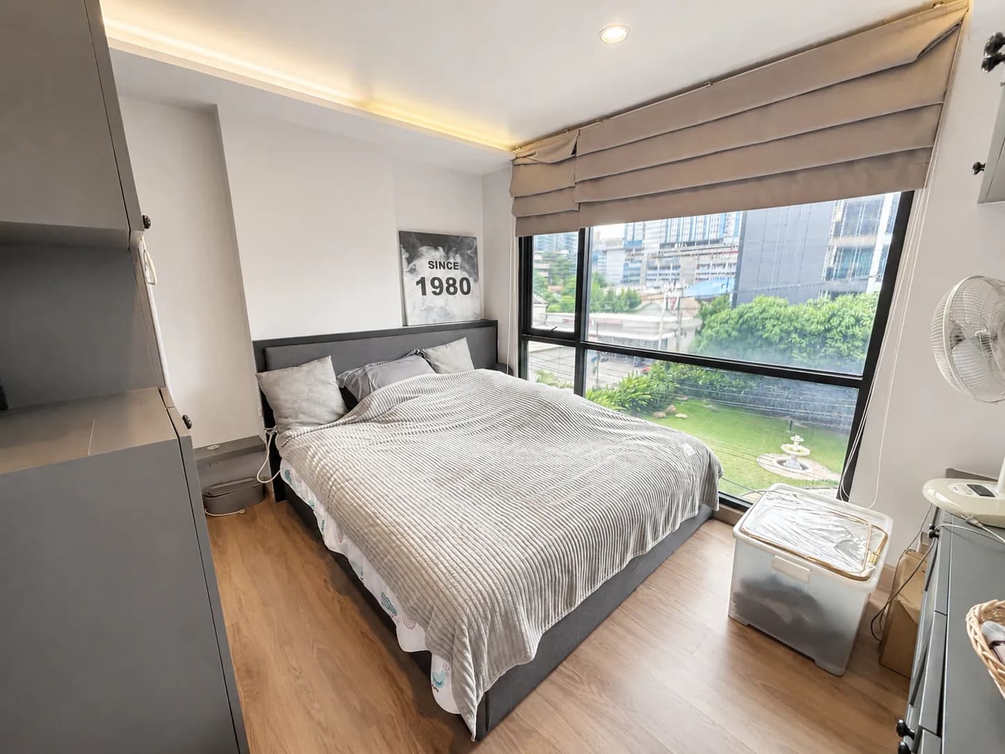 Bedroom with large window at The Unique Ratchada 19