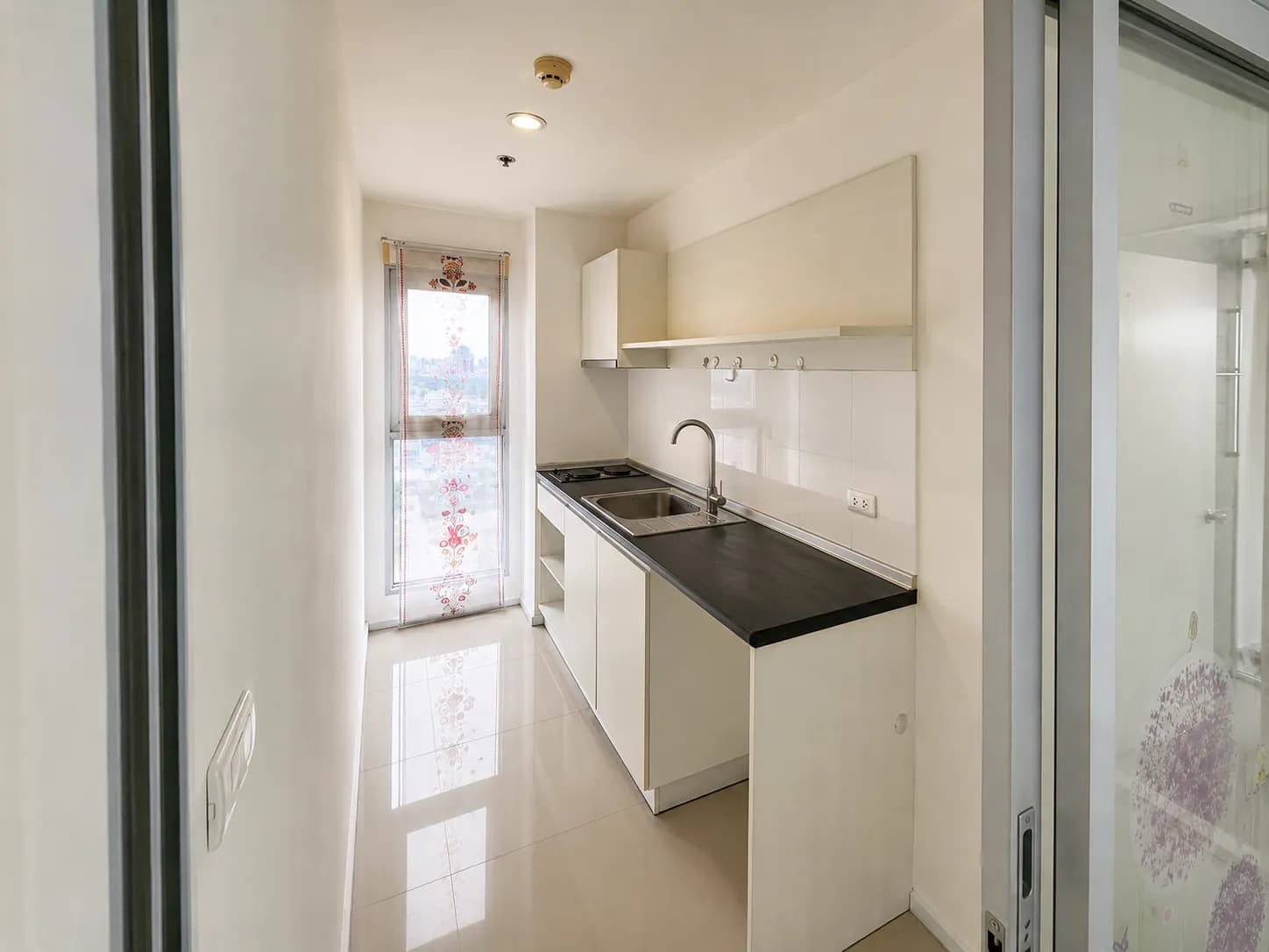 Compact kitchen inside the Aspire Sukhumvit 48 unit