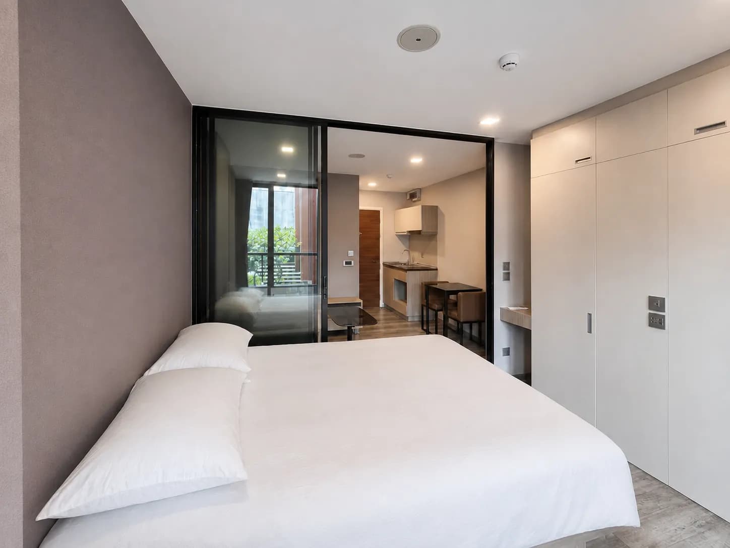 Bedroom and kitchenette in the Brown Condo unit
