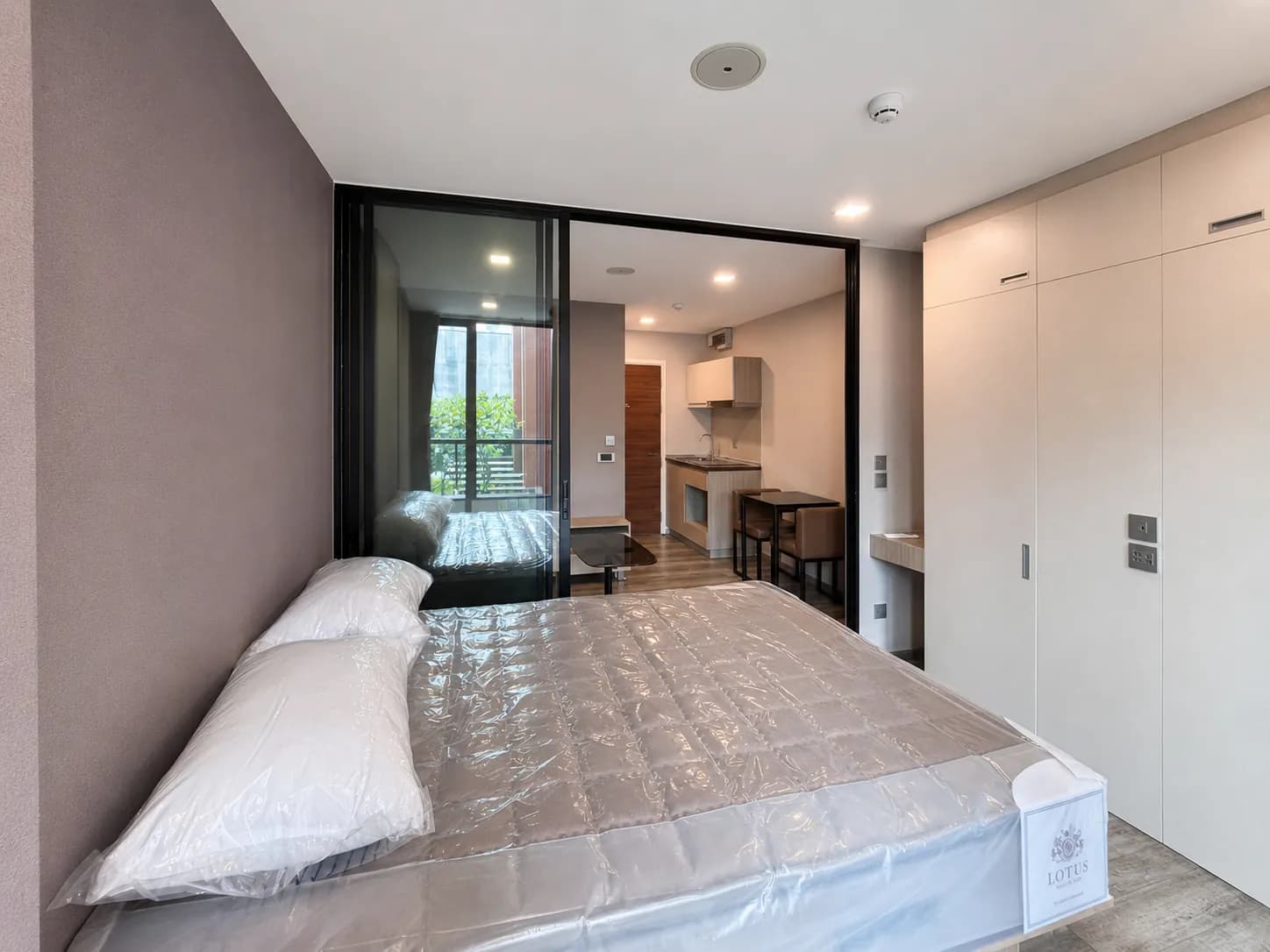 Bedroom and kitchenette in the Brown Condo unit