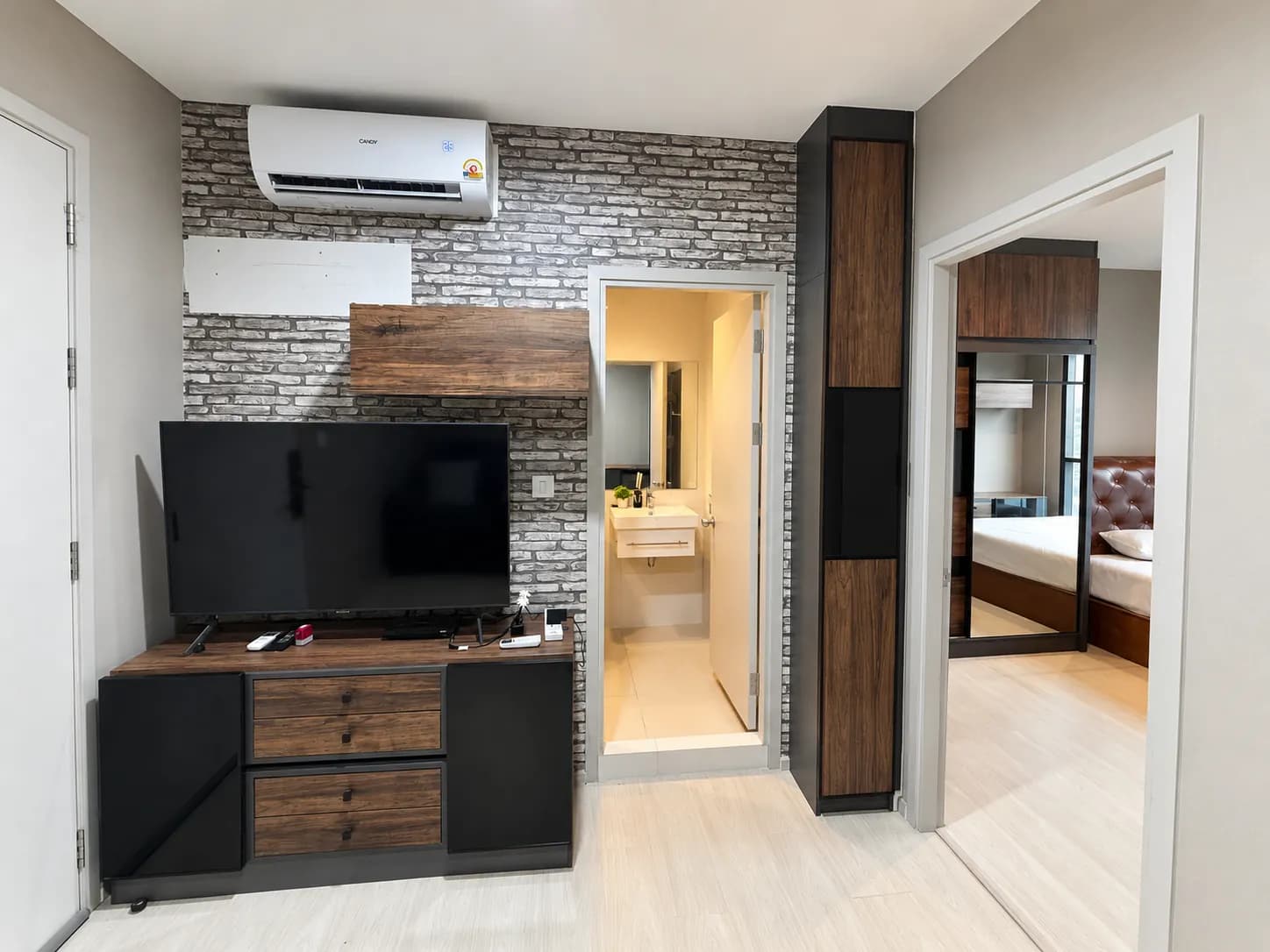 Living room and television area in the Life Sukhumvit 48 unit