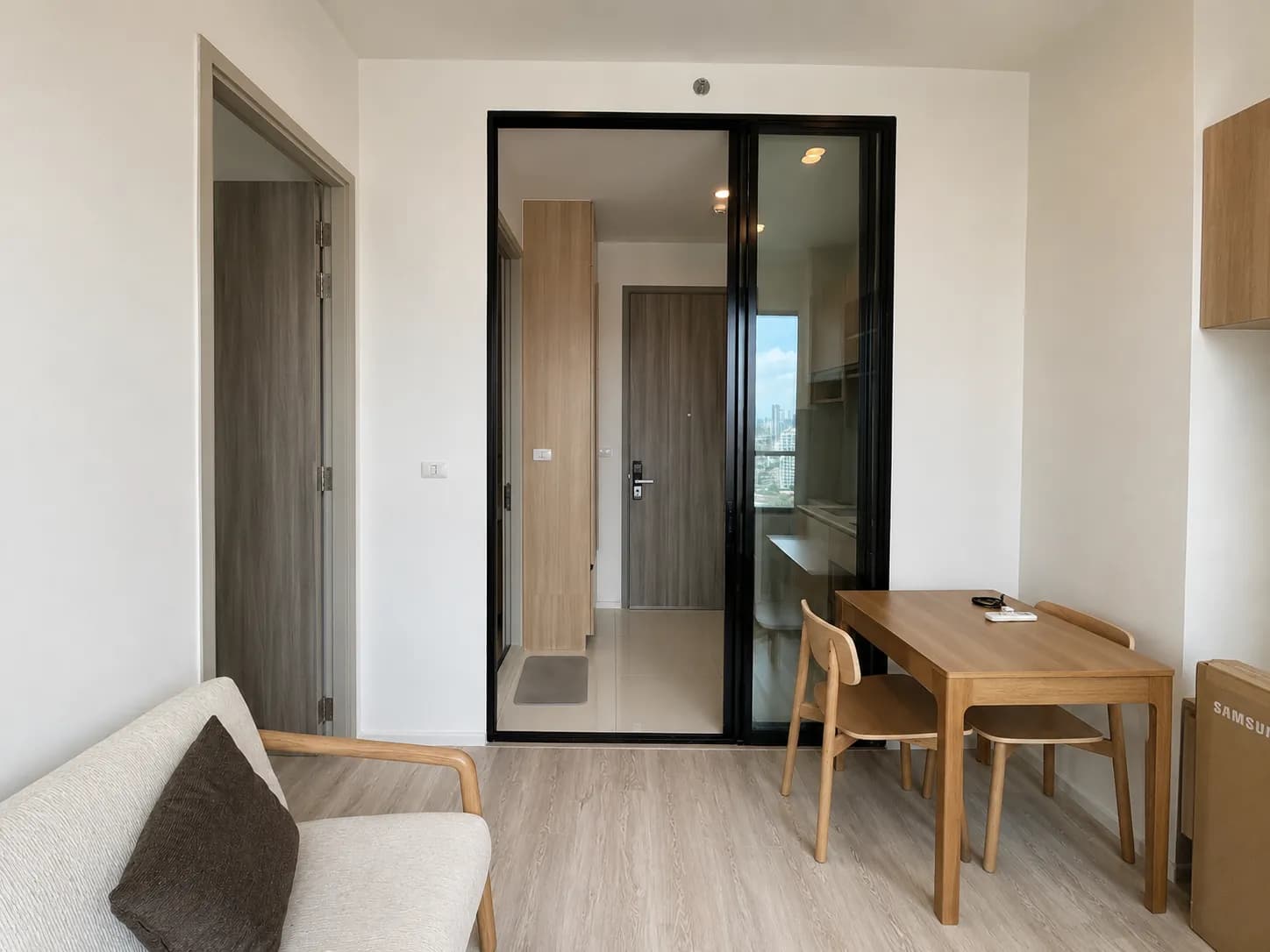 Dining nook and living area in the 34.49 sqm unit