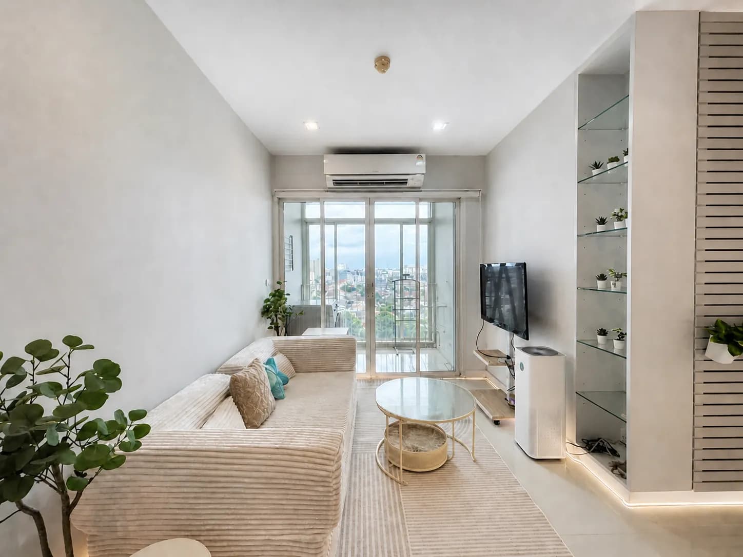 Living room and balcony view in the Ideo Verve Sukhumvit unit